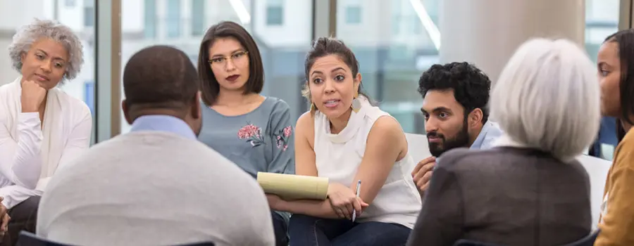 group of people sitting and talking