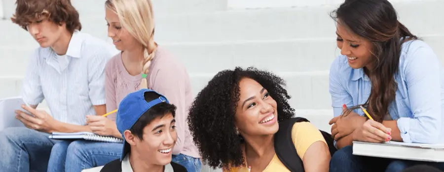 students sitting outside