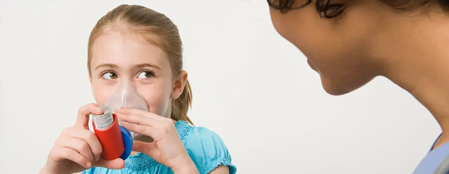 A child learning how to use quick-relief medication